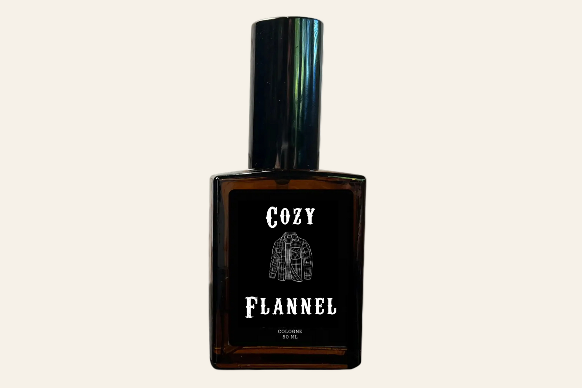 Brown perfume bottle labeled 'Cozy Flannel' on a white background