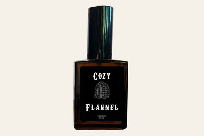 Brown perfume bottle labeled 'Cozy Flannel' on a white background