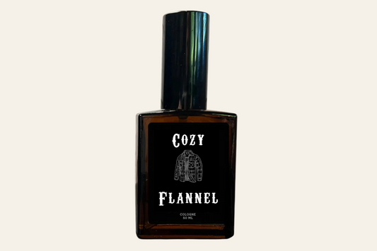 Brown perfume bottle labeled 'Cozy Flannel' on a white background