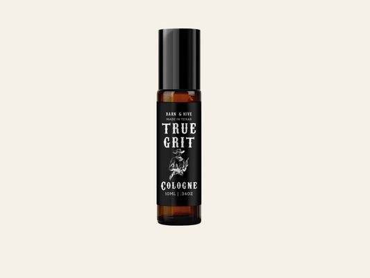 Bottle of True Grit cologne on a white background